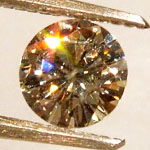 moissanite gemstone with orange sparkle