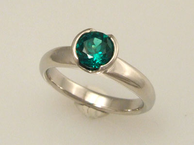 emerald solitaire engagement ring
