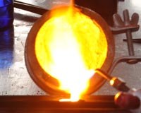 melting gold and pouring an ingot